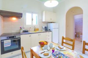 Kuchyň nebo kuchyňský kout v ubytování Fran Apartments