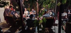 a group of people sitting around a table at La Actoru` in Vama Veche