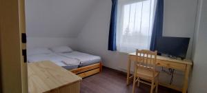 Un ou plusieurs lits dans un hébergement de l'établissement Apartmány u Bernardů