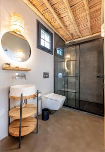 a bathroom with a toilet and a sink and a shower at Dmira Alacati in Alaçatı