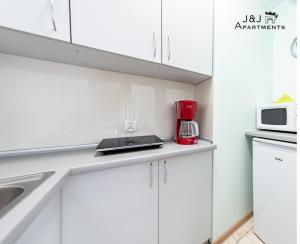 Kuchyňa alebo kuchynka v ubytovaní J&J Apartments, Szeroka 25, Apartament 14