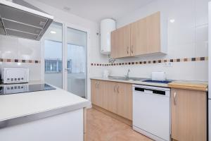 Kuchyň nebo kuchyňský kout v ubytování Exclusivo Dúplex Carrera