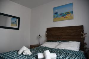 Postel nebo postele na pokoji v ubytování Appartement T3 (plain-pied) et son jardin privatif clos à Vieux Boucau