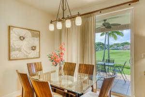 a dining room with a glass table and chairs at Pili Mai 10F in Kipu