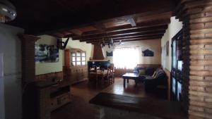 a living room with a couch and a table at Los rosales in Burunchel