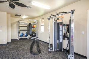 a fitness room with a gym with weights at Pili Mai 7H in Koloa