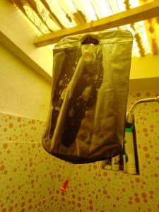 a bag hanging from a ceiling in a room at Hostal Qhana Pacha in Isla de la Luna