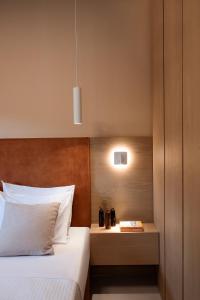 Postel nebo postele na pokoji v ubytování Chronos Hotel