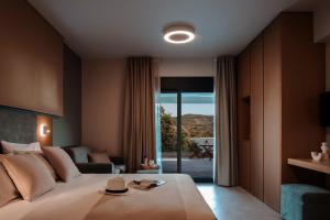Postel nebo postele na pokoji v ubytování Chronos Hotel