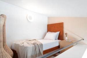 Postel nebo postele na pokoji v ubytování Chronos Hotel