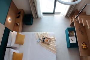 Postel nebo postele na pokoji v ubytování Chronos Hotel