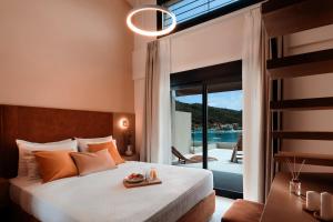Postel nebo postele na pokoji v ubytování Chronos Hotel