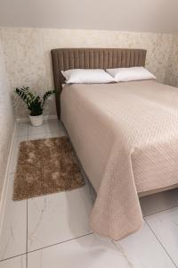 Posteľ alebo postele v izbe v ubytovaní Bianco Apartamenty Laskowa - Zator