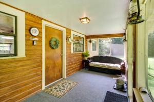 a hallway with a door and a bed in a room at River Frontage Quiet Mississippi Vacation Rental in McComb