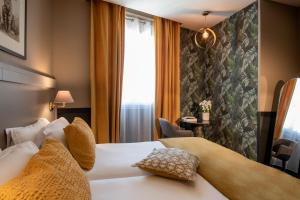 Postel nebo postele na pokoji v ubytování Best Western Plus Nice Cosy Hotel