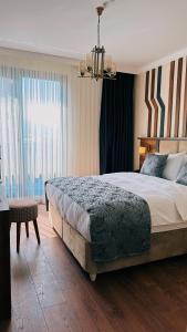 Postel nebo postele na pokoji v ubytování BİLİRİS HOTEL