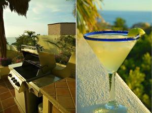 a drink sitting on a table with a lime in it at Villa Turnage in Cabo San Lucas