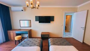 Postel nebo postele na pokoji v ubytování BİLİRİS HOTEL