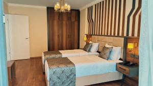 Postel nebo postele na pokoji v ubytování BİLİRİS HOTEL