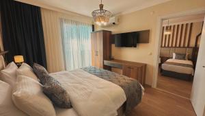 Postel nebo postele na pokoji v ubytování BİLİRİS HOTEL