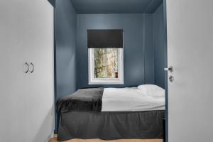 En eller flere senger på et rom på ARCTIC HOMES - Quality Living