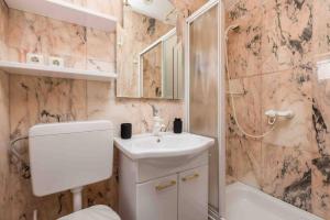 a bathroom with a sink and a toilet and a shower at Villa The Nest in Opatija +63 photos