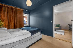 En eller flere senger på et rom på ARCTIC HOMES - Quality Living + 22 bilder