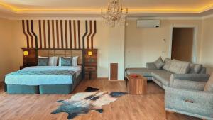 Postel nebo postele na pokoji v ubytování BİLİRİS HOTEL