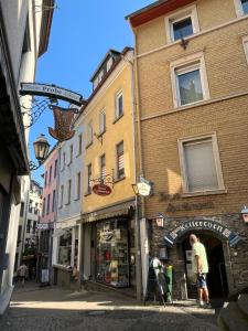 a man standing in the doorway of a building at Meyver Cochem Centrum. in Cochem