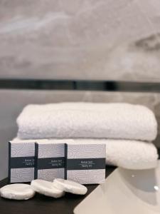 two stacks of towels on a table with towels at BİLİRİS HOTEL in Trabzon