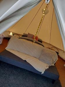 a tent with a mattress in a room at Carrowmena Family Glamping Site & Activity Centre in Limavady