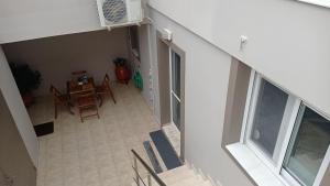 an overhead view of a room with a table and chairs at Elena in Artemida