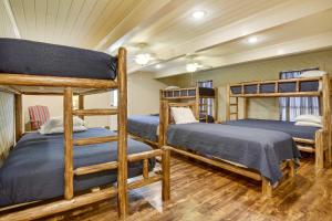 a room with three bunk beds in a house at Dularge Grand Villa - Steps to Marina and Fishing! in Theriot +34 photos