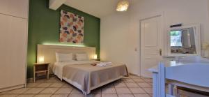 Posteľ alebo postele v izbe v ubytovaní Panorama Apartments Fiscardo