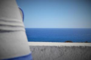 a view of the ocean from a window of a building at Summer Residence in Provatas