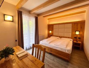 Katil atau katil-katil dalam bilik di Hotel Garni My Ledro