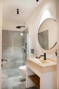 a bathroom with a sink and a mirror at ARTOTEL in Alaçatı