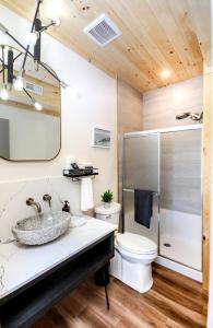 a bathroom with a sink and a toilet at Stone Cove Waterfront Adults Only B&B in Tobermory