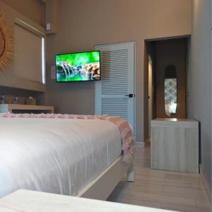Postel nebo postele na pokoji v ubytování Trópica Beach Hotel