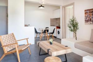 a living room with a couch and a table at Jonathan City Apartment in Kos Town