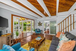 a living room with a couch and a table at Emmalani 3BR Princeville Villa with Private Pool in Princeville