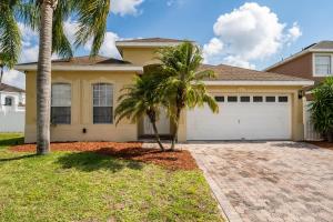 a house with palm trees in front of it at bsv_villa424 in Davenport