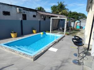 a swimming pool in the backyard of a house at kdk villa in Buccoo