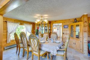 a dining room with a table and chairs at Sunny Cedaredge Home with Mtn Views - Hike and Fish! in Cedaredge