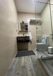 a bathroom with a sink and a toilet at Beach breeze in Essaouira +8 photos