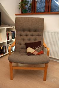 a chair with a pair of shoes sitting on it at Bed & Breakfast Horsens in Horsens
