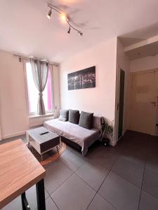 Ένα ή περισσότερα κρεβάτια σε δωμάτιο στο Logesty Home proche Paris et Metro