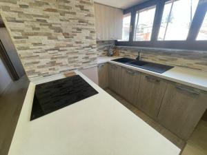Kuchyň nebo kuchyňský kout v ubytování GG Apartment
