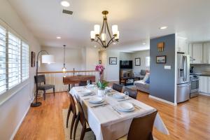 a dining room and living room with a table and chairs at Charming San Jose Home with Covered Patio and Backyard in San Jose