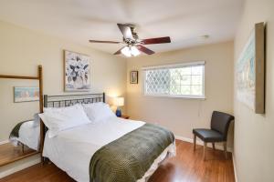 a bedroom with a bed and a ceiling fan at Charming San Jose Home with Covered Patio and Backyard in San Jose